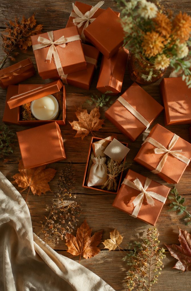 20 Burnt Orange Wedding Decor Ideas for 2026 18 Burnt orange gift boxes arranged for wedding favors.