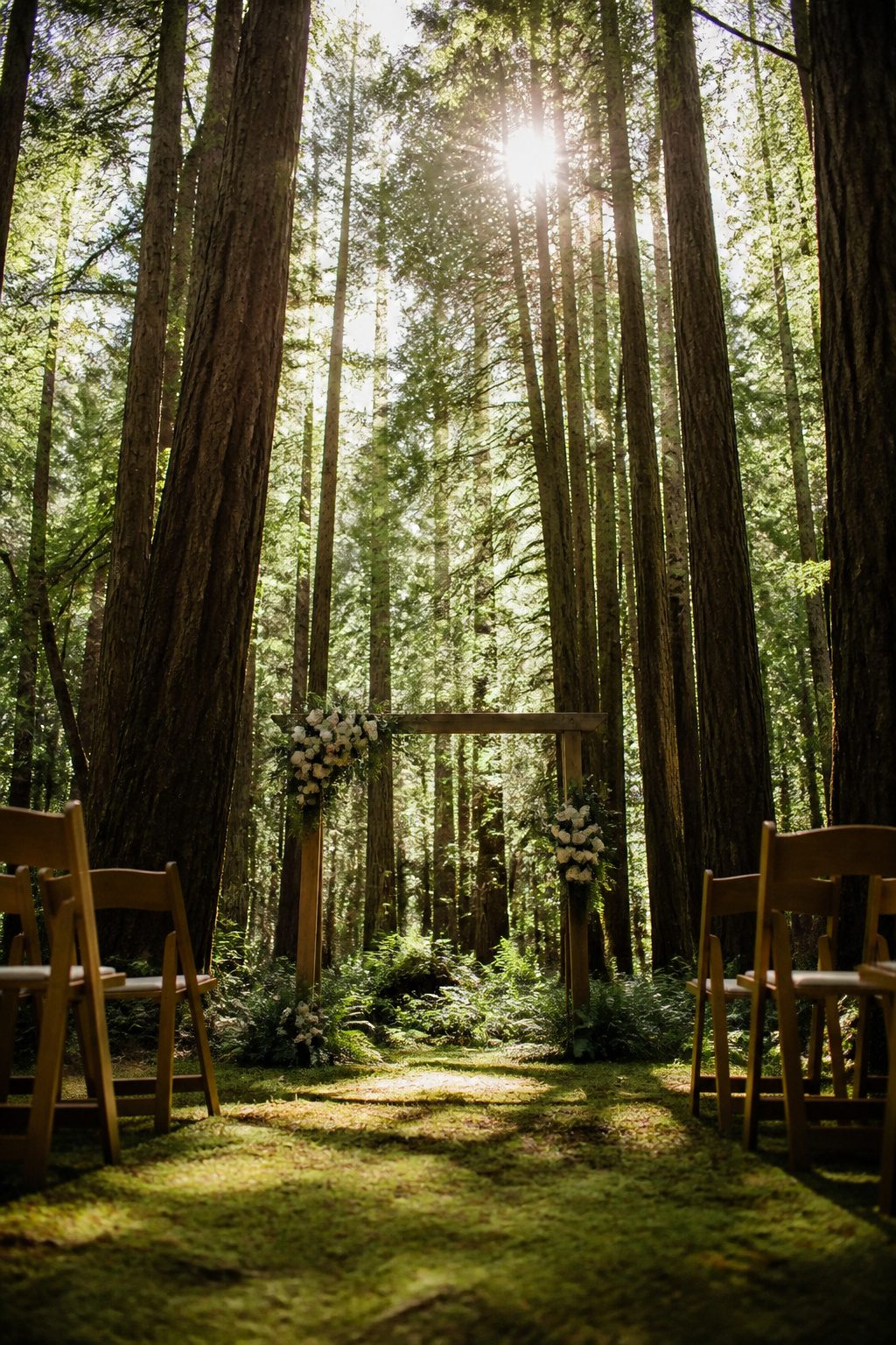 Couple standing among tall coast redwoods during a wedding.