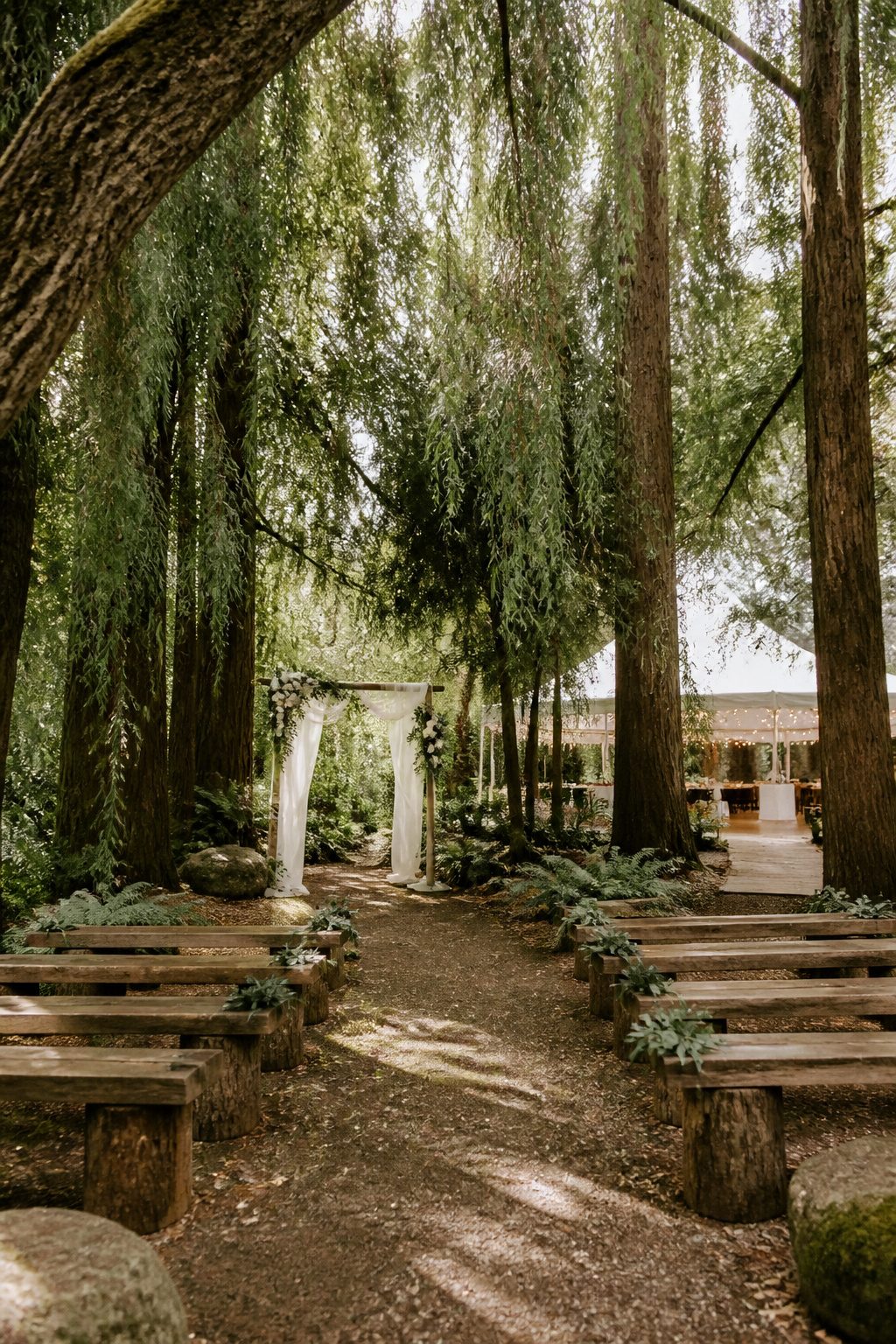 Shaded ceremony site at Twin Willow Gardens with greenery.