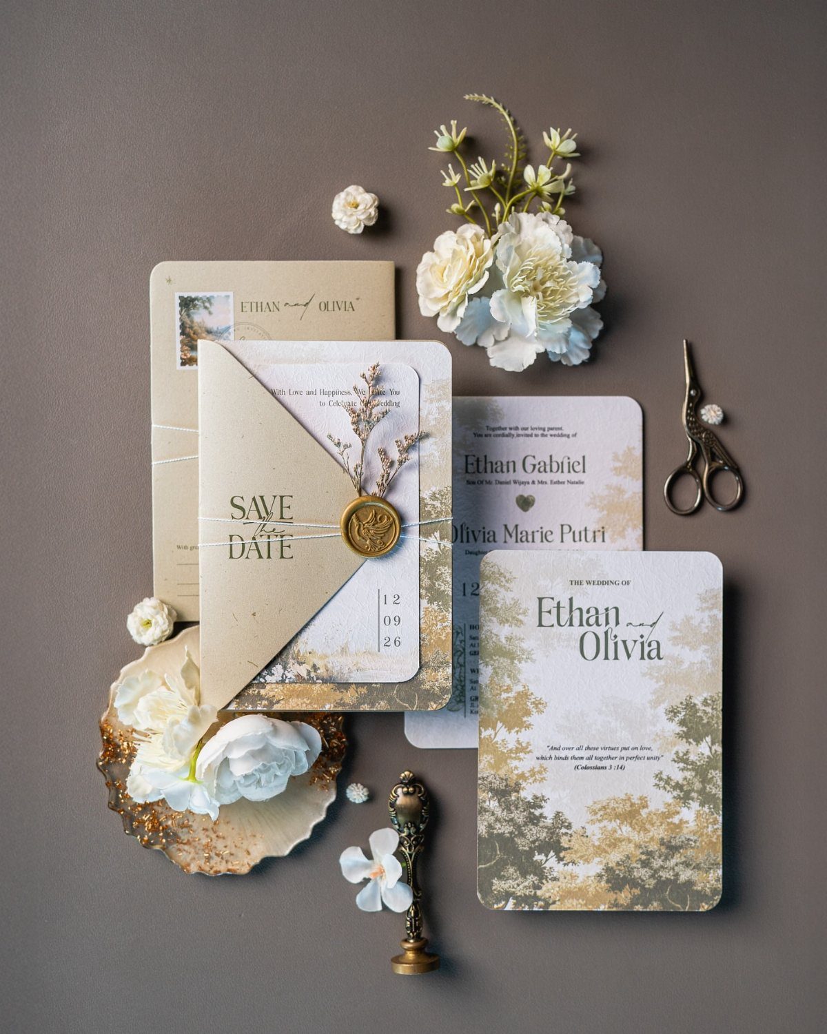 Garden-themed wedding invitations with botanical prints, wax seals, and dried flowers on a dark background.