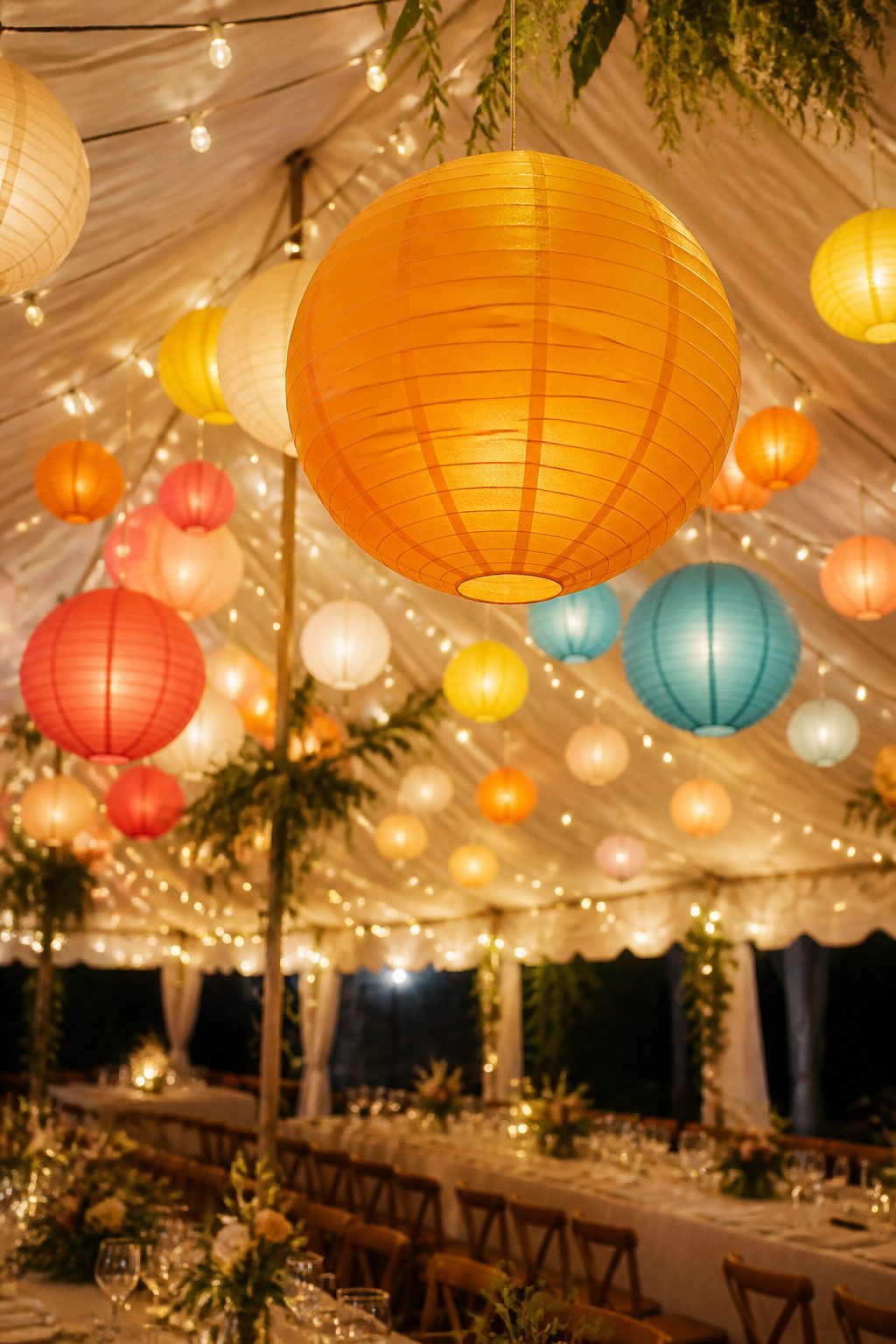 Colorful paper lanterns suspended from the ceiling at different heights.