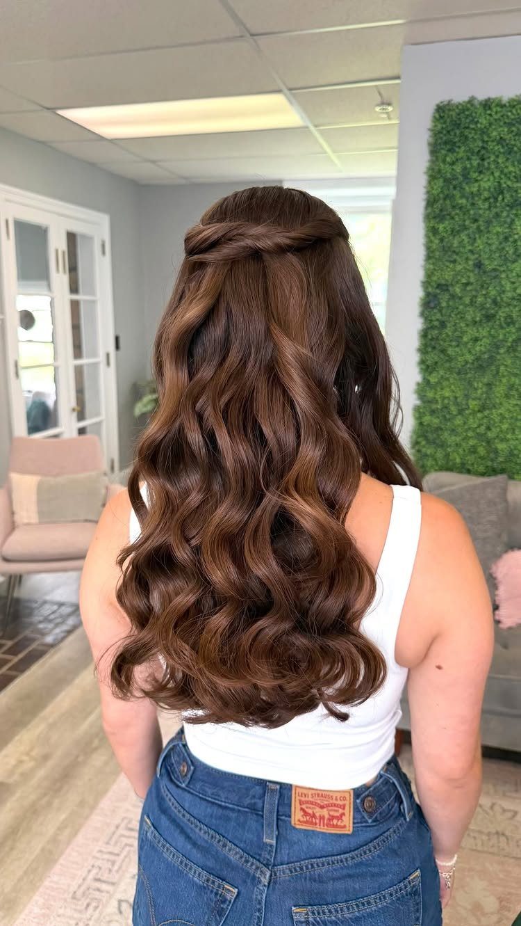 5 Wedding Hair Inspo Ideas for Brides From Loose Curls to Hollywood Waves 1 Long brunette hair styled in voluminous, bouncy loose curls with a half-up design.