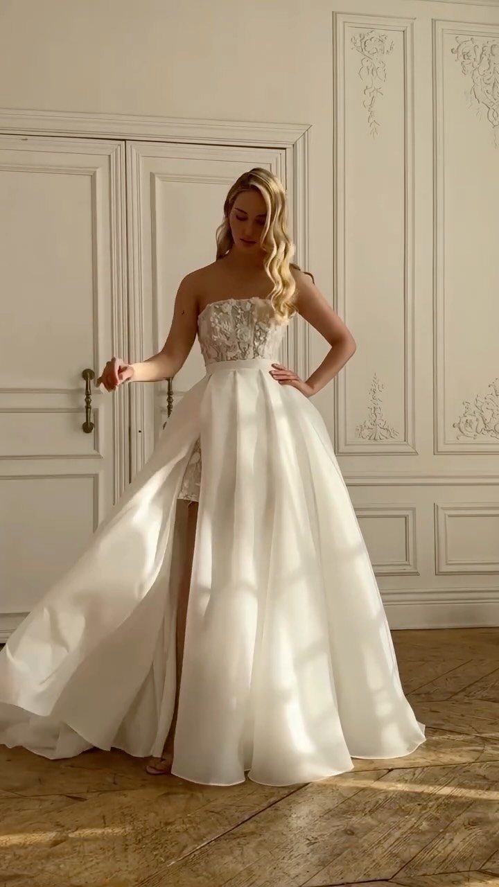 Wedding Outfit for Europe: 6 Ideas for 2026 Ceremonies Abroad 3 Blonde woman posing in a white lace wedding dress with a long detachable skirt.
