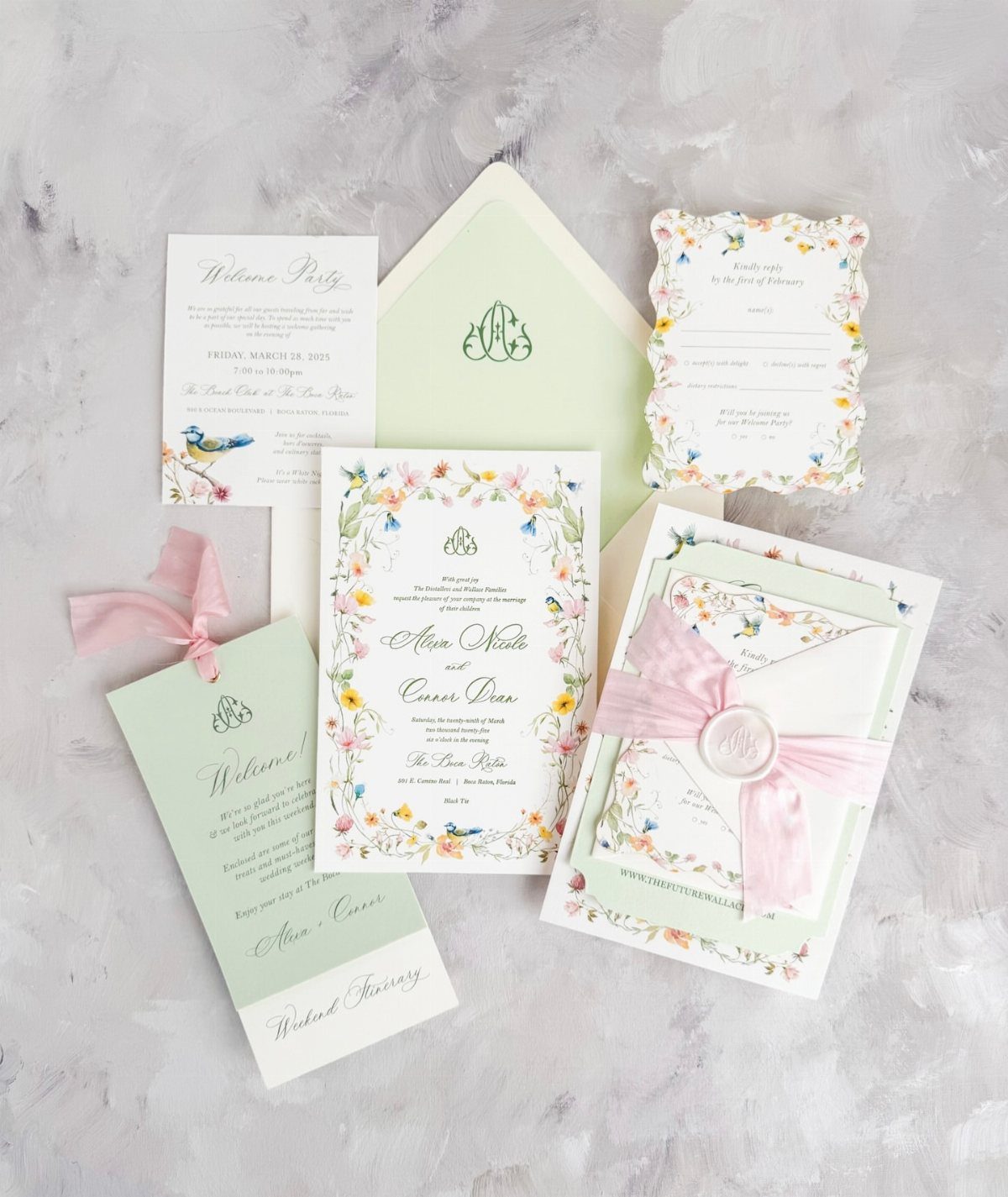 Wedding stationery set with colorful watercolor floral illustrations and pink ribbons on a grey background.