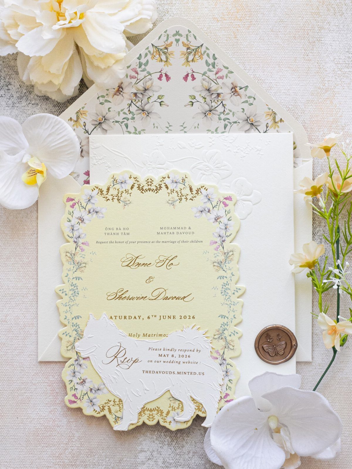 Wedding invitation with scalloped edges, floral illustrations, and white orchids on a textured background.