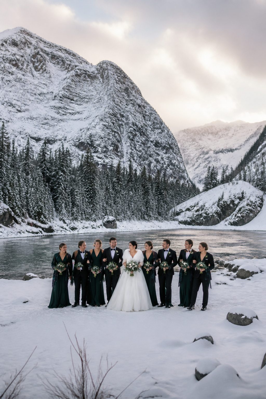 Group portraits taken in the snow during a wedding.
